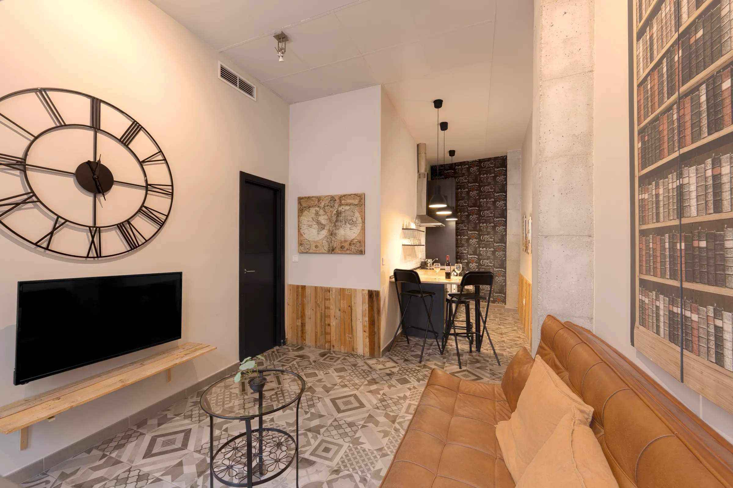 Living room with wall clock and leather sofa