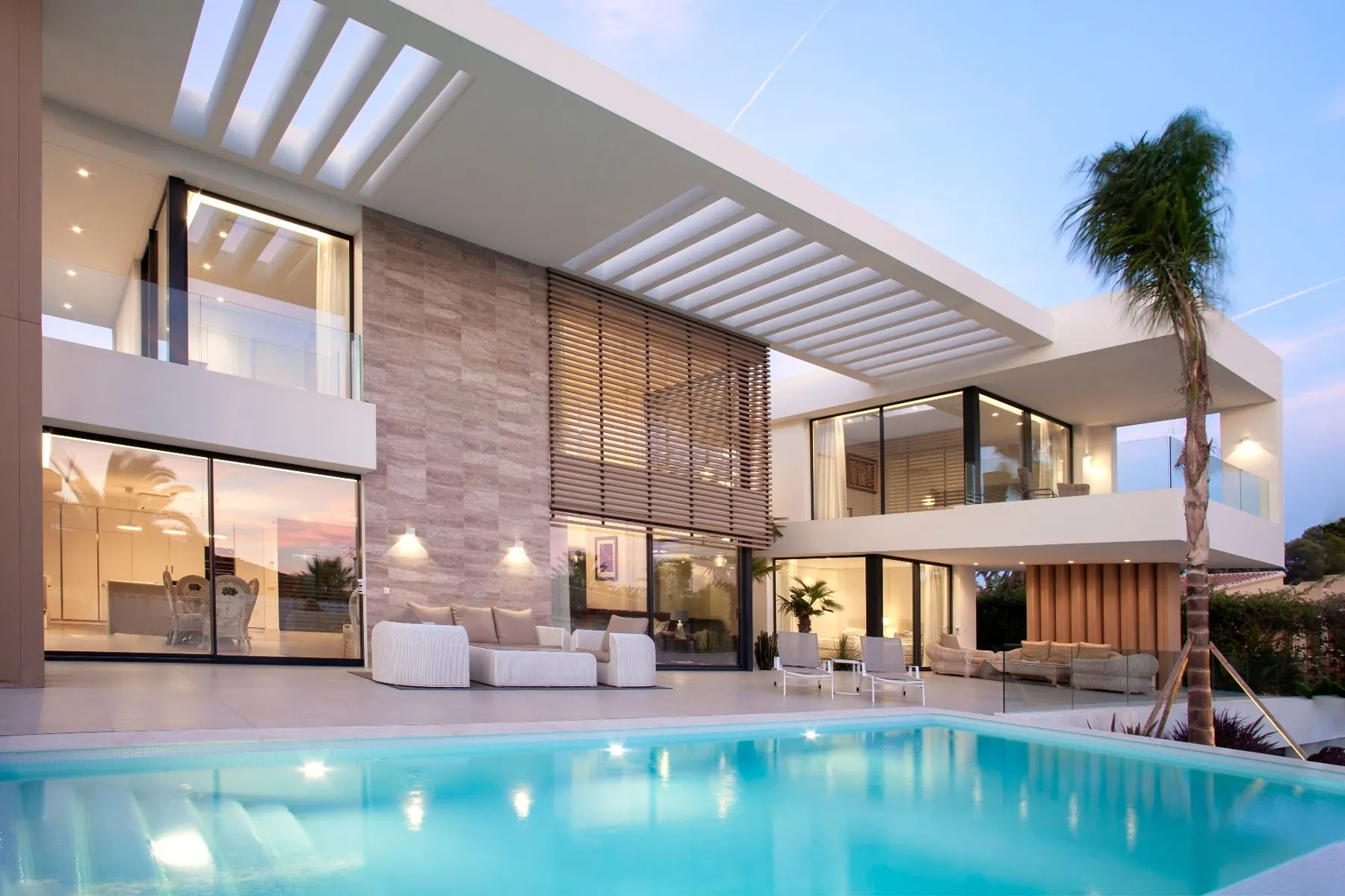 Stone and timber façade in front of the pool