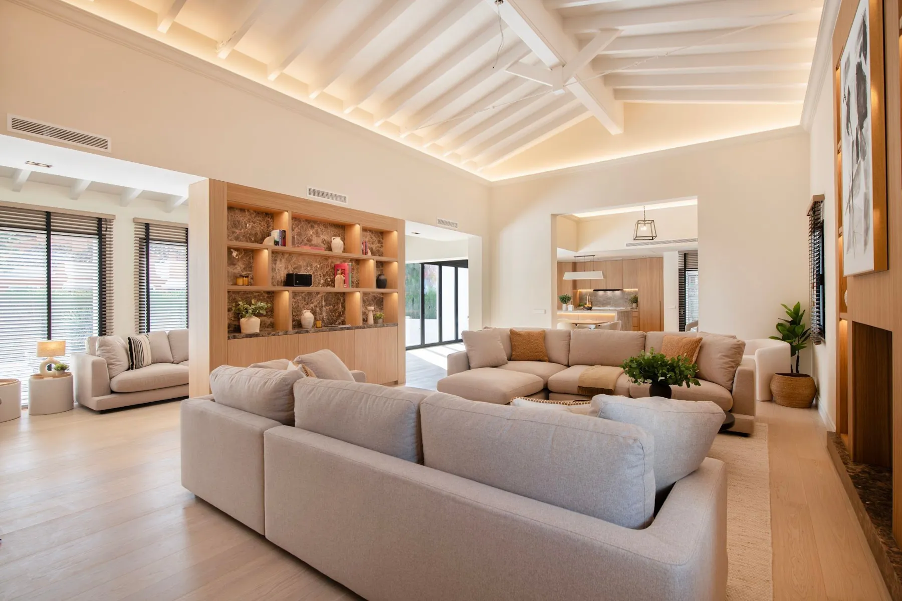 Living room with lit shelving