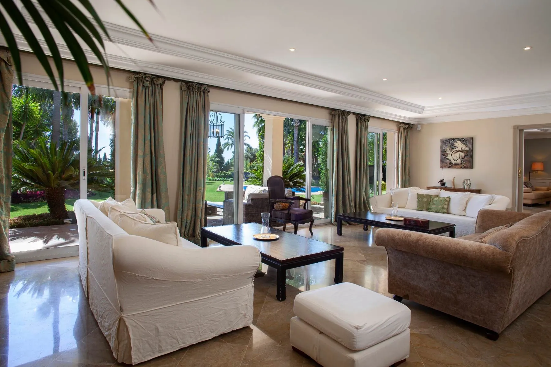 Living room with sofas and garden views