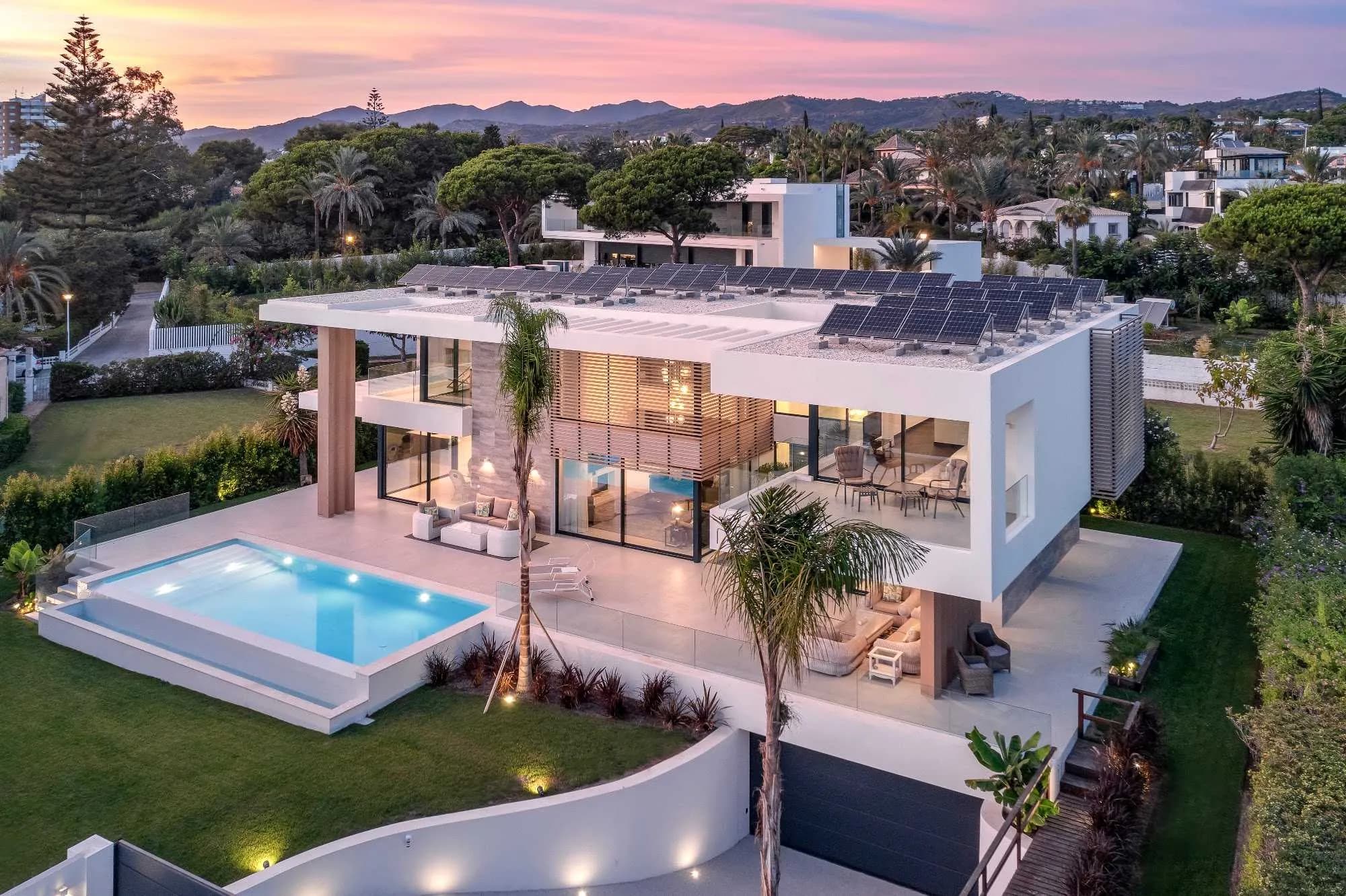 Aerial view of a villa with pool in Marbella at sunset